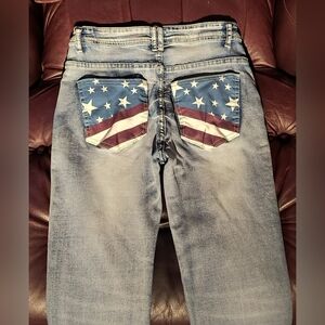 Unbranded jeans /American flag pockets.  Lightly worn.